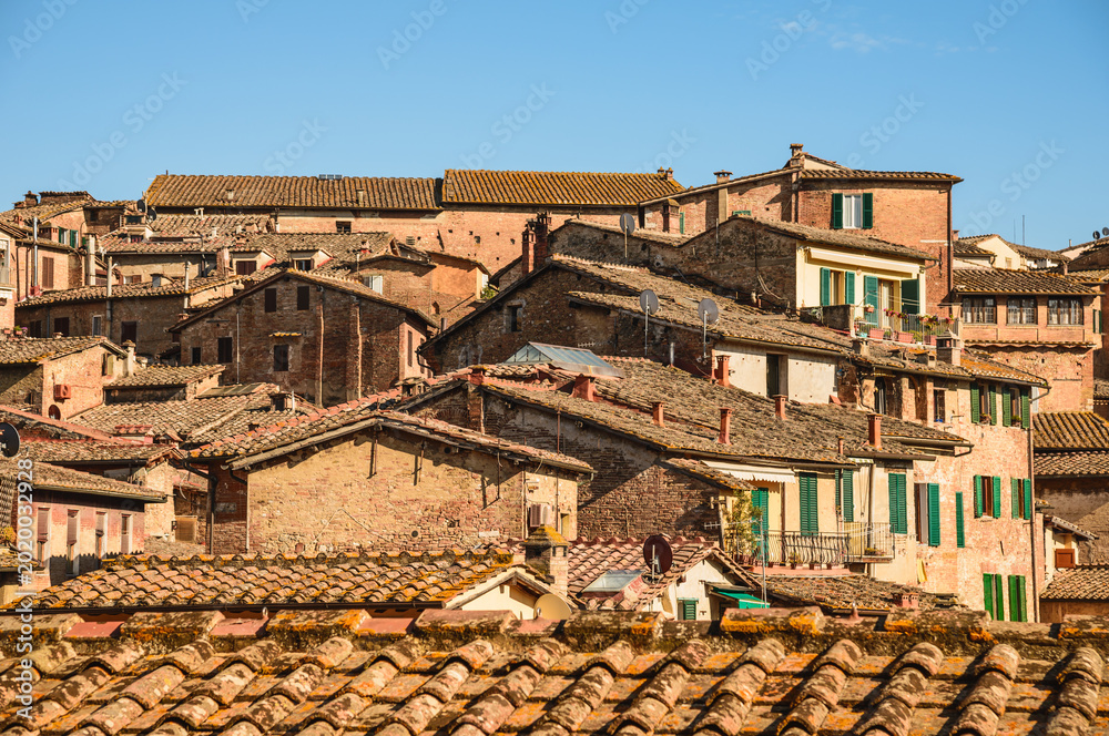 Fototapeta premium View of Siena old medieval town rooftops, Tuscany, Italy