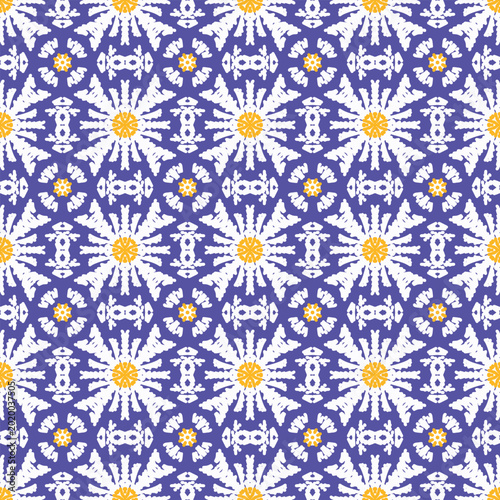 A seamless floral pattern with blue and yellow flowers forms a vintage geometric ornament texture design for textile wallpaper decoration
