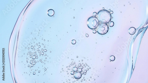 Close up of fluid iridescent bubbles with pink and blue highlights.