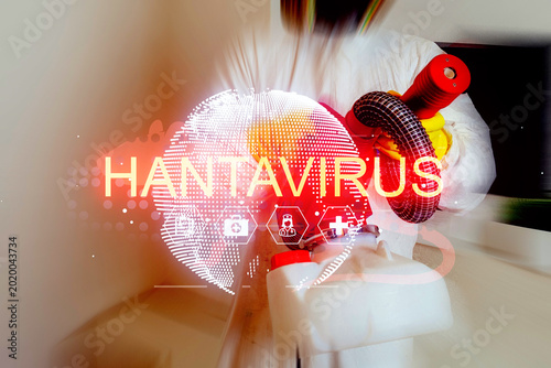 Foto Worker in a white suit uses a cleaning device to decontaminate a space for hanta
