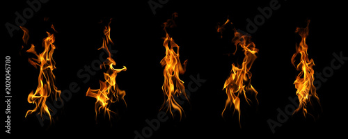 Fotografie Collection of realistic fire flames isolated on black background, featuring blazing heat, burning energy, abstract motion, orange light, and dramatic flame texture for design elements
