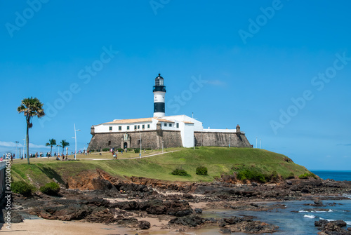 Slika na platnu The Barra Lighthouse or Santo Antônio Fort is an iconic tourist attraction in Salvador, Bahia