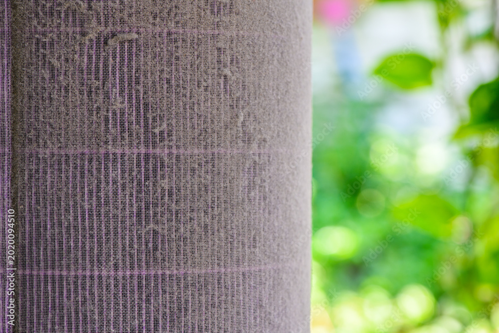 Fotografia Dusty Air Conditioner Filter Close Up with Nature Background PM2