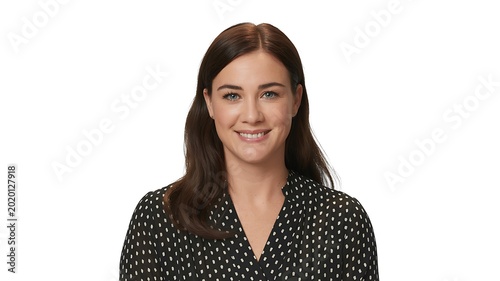 Smiling businesswoman in black polka dot blouse