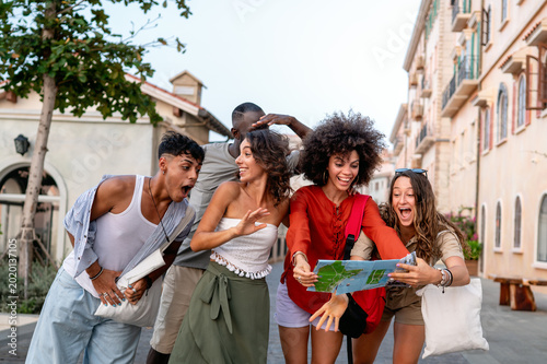 Quadro su tela Diverse group of friends celebrates joy and togetherness while traveling, expres