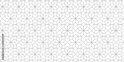 An elegant seamless pattern featuring traditional oriental floral motifs and symmetrical geometric lines. This sophisticated black and white ornament is inspired by classical Islamic
