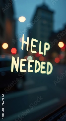 Sign that says help needed on the window