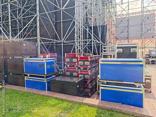 Outdoor concert stage setup with metal scaffolding