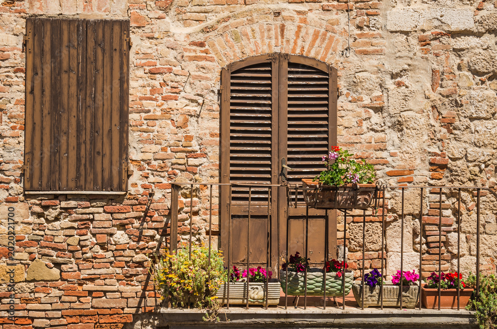 Obraz premium Italian window and door details of medieval house in Chianti, Tuscany, Italy