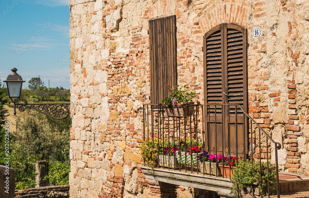Obraz premium Italian window and door details of medieval house in Chianti, Tuscany, Italy