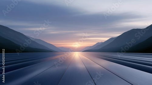 Landscape photograph of a long, straight road that stretches into the distance between two mountains.