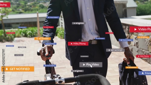 Businessman commuting, pushing bicycle, camera panning up, UI badges surrounding bag and helmet