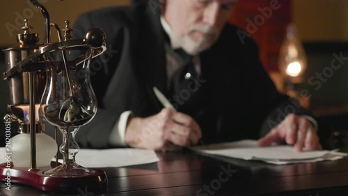 Victorian businessman sealing a letter with wax, focus on coffee maker