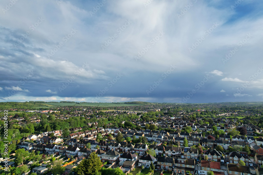 Obraz premium Aerial View of Luton City During Sunset Time. Drone Flight Above Urban City Streets of British City and Town of England Great Britain. Drone Mounted Wide Angle Camera Footage