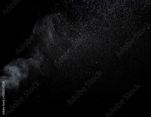 a black background with a few specks of dirt