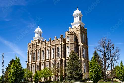 Logan Utah Temple Exterior Historic LDS Church Building with Mountains and Blue Sky