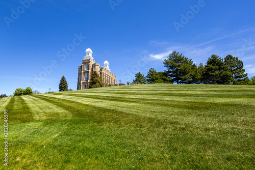 Logan Utah Temple Exterior Historic LDS Church Building with Mountains and Blue Sky