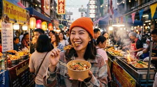 Smiling woman eating street food at market  travel festival asian culture  happy young lifestyle urban city holiday  orange hat