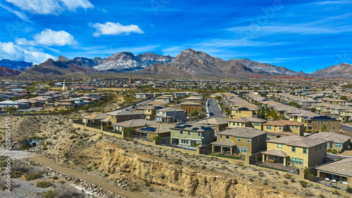 Aerial Nevada Neighborhood With Red Rock Mountains and Snow in Las Vegas