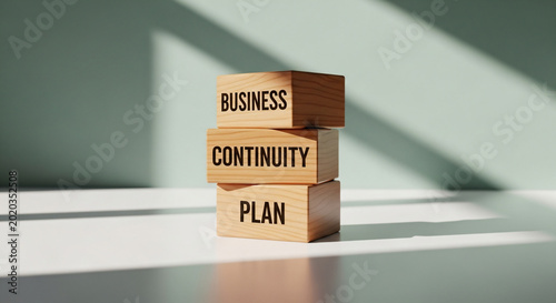 Business Continuity Plan Text On Stacked Wooden Cubes In Sunlight