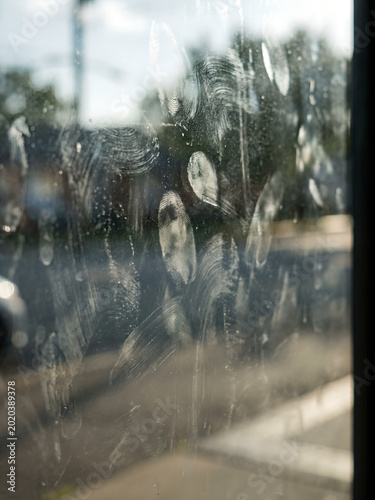 Fingerprints and oily smudges on glass surface macro close-up