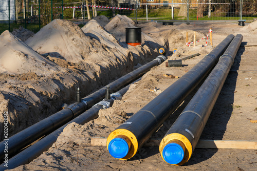 Foto Pre-insulated underground heating pipes prepared for district heating network in