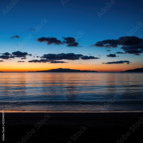 Tranquil Sunset Over the Ocean with Dramatic Clouds.