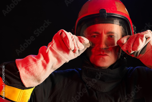 Mature male firefighter wea...