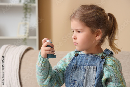 Cute little girl with asthm...