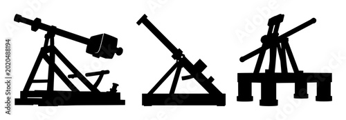 Photography Medieval trebuchet siege engine set with solid black silhouette design featuring