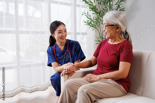 Photos Professional young asian nurse providing caring home care support and medical as