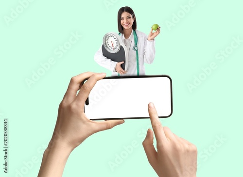 Hands holding mobile phone ...