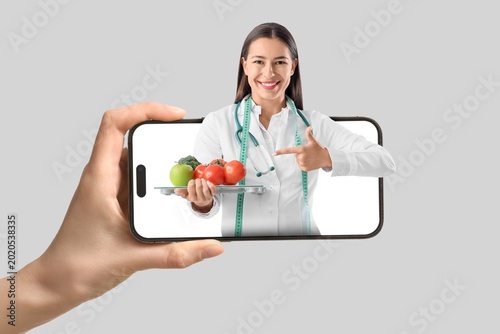 Hand holding mobile phone w...