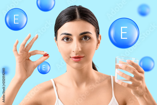 Young woman with glass of w...