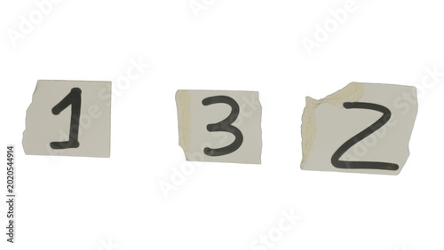 Three torn paper pieces with numbers one, two, and three