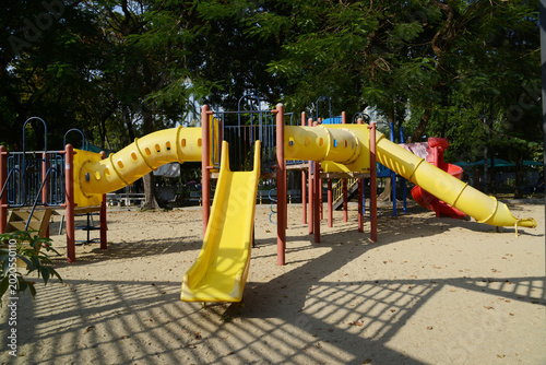 Climbing structures and slides are playground equipment for children, which are part of the Lumpini public park in Bangkok capital city , Thailand.