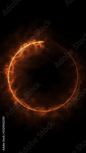 Fiery circle frame spinning with orange smoke on black background.