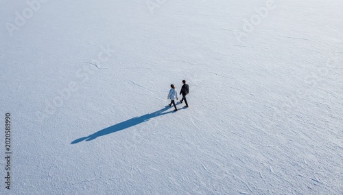 Couple Walking on Vast White Salt Flats