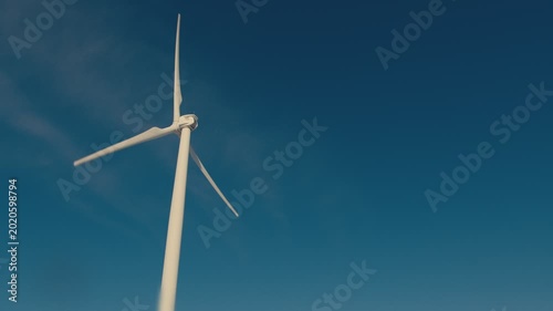 White wind turbine generating renewable energy