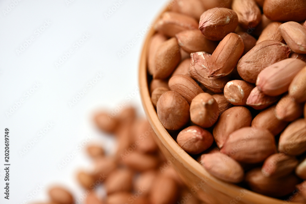 Obraz premium Peanuts in Bowl Top View with Defocus Background Macro Photography