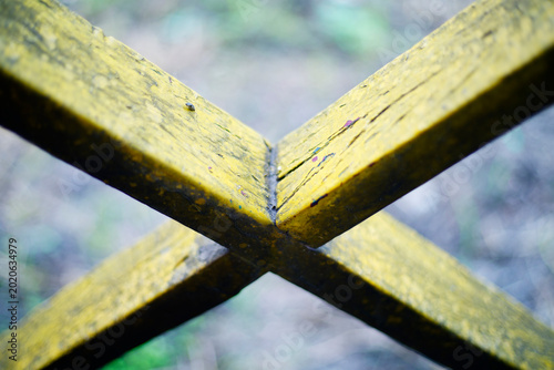 Canvastavla Close-up of Wet Wooden Crossbeam with Yellow Moss on a Bridge Structure