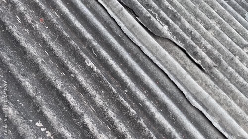 Severe crack on corrugated asbestos roof texture background