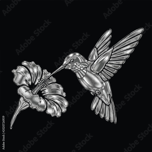 Metal hummingbird sips from flower on black background