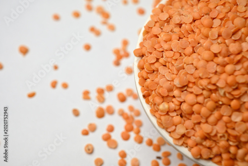 Split Red Lentils (Masoor Dal) Angled Top View with Negative Space and Defocus Background Macro Photography