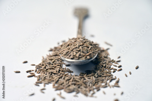 Cumin Seeds in Spoon Angled Top View with Defocus Background Macro Photography