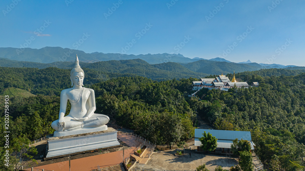 Αυτοκόλλητο The historic stupa of Wat Phra That Pu Jae in Phrae Province is a centuries old sacred site situated on a mountain
