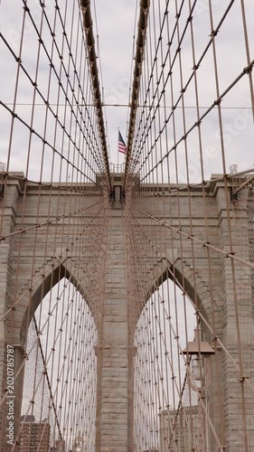 Brooklyn Bridge tower with American flag in New York City
