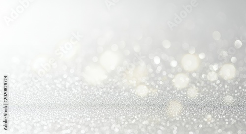 Elegant Silver Glitter Background with Bokeh Lights.