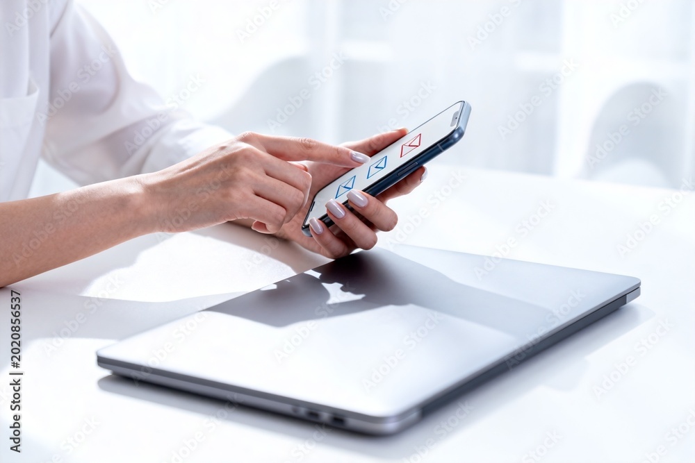 Fototapeta premium Person using smartphone with email app