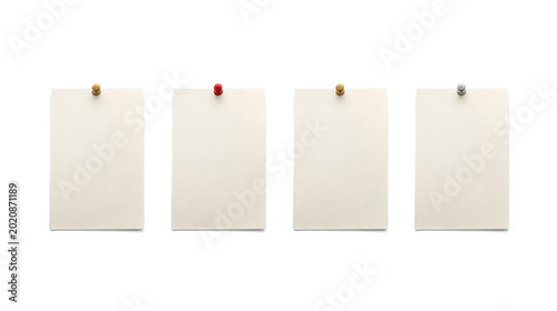 identical rectangular sheets of paper pinned to a white background. Each sheet is secured by a small, round thumbtack at the top center, with the thumbtacks varying slightly in color from brass to sil